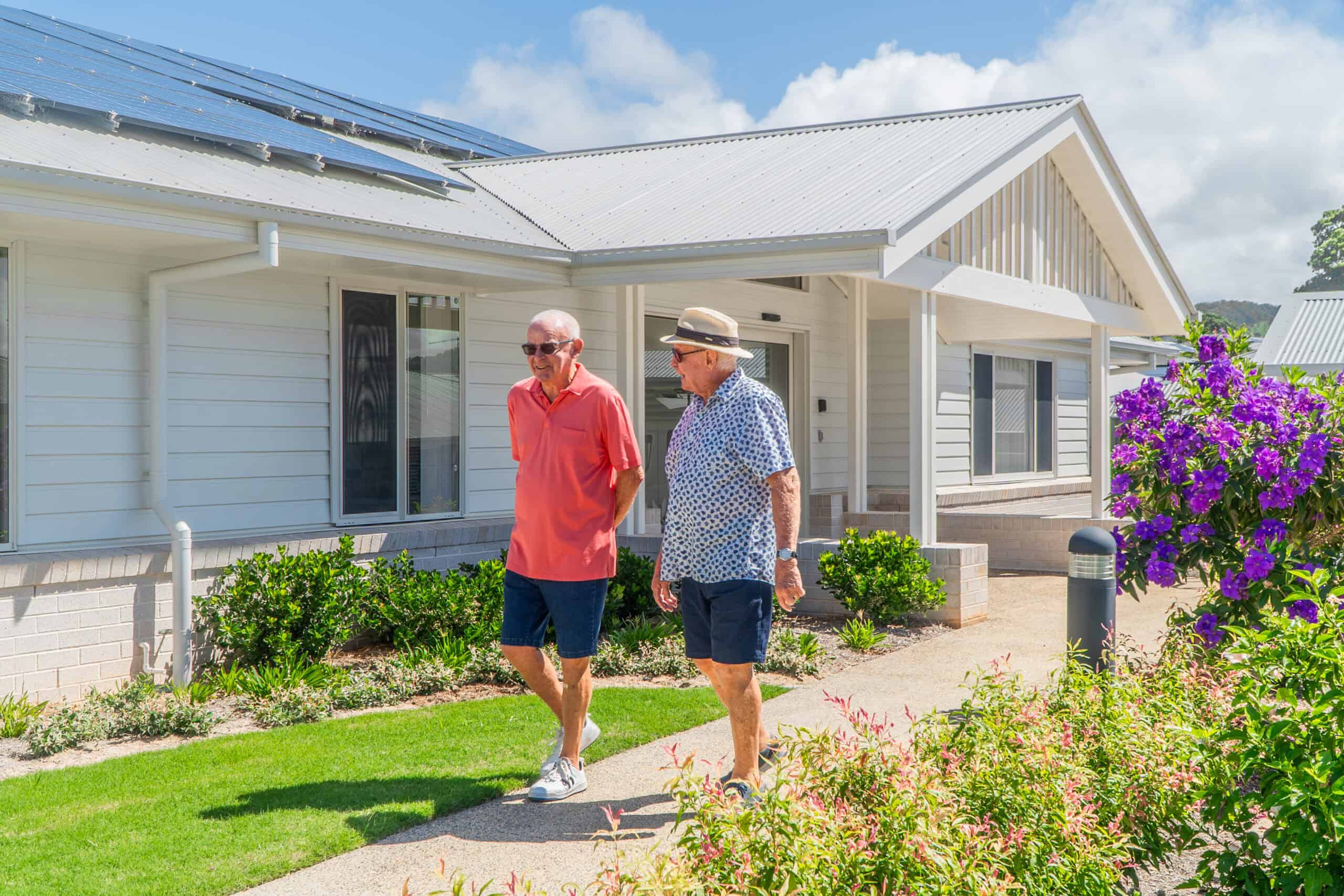 Two seniors enjoying a walk around Oak Tree Retirement Villages Coffs Harbour