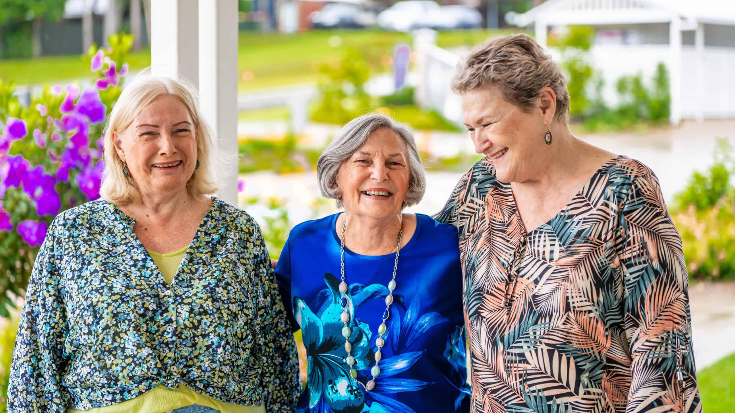 Three women smiling together at Coffs Harbour Retirement Village