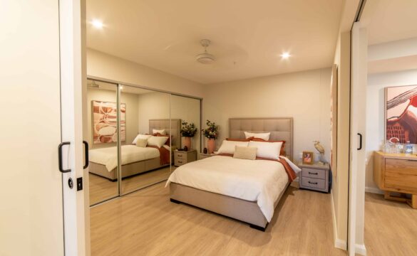 Bedroom with built in mirrored wardrobes in one of our Oak Tree Retirement village apartments.