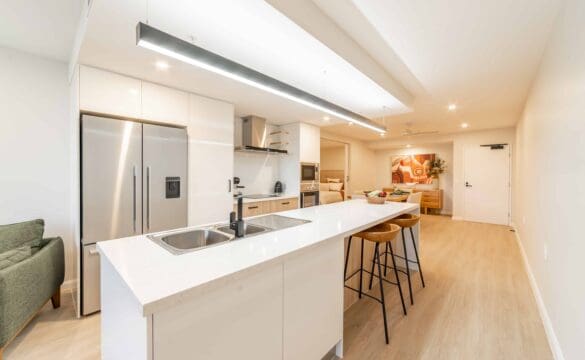 Modern white kitchen in one of our Oak Tree Retirement village apartments.