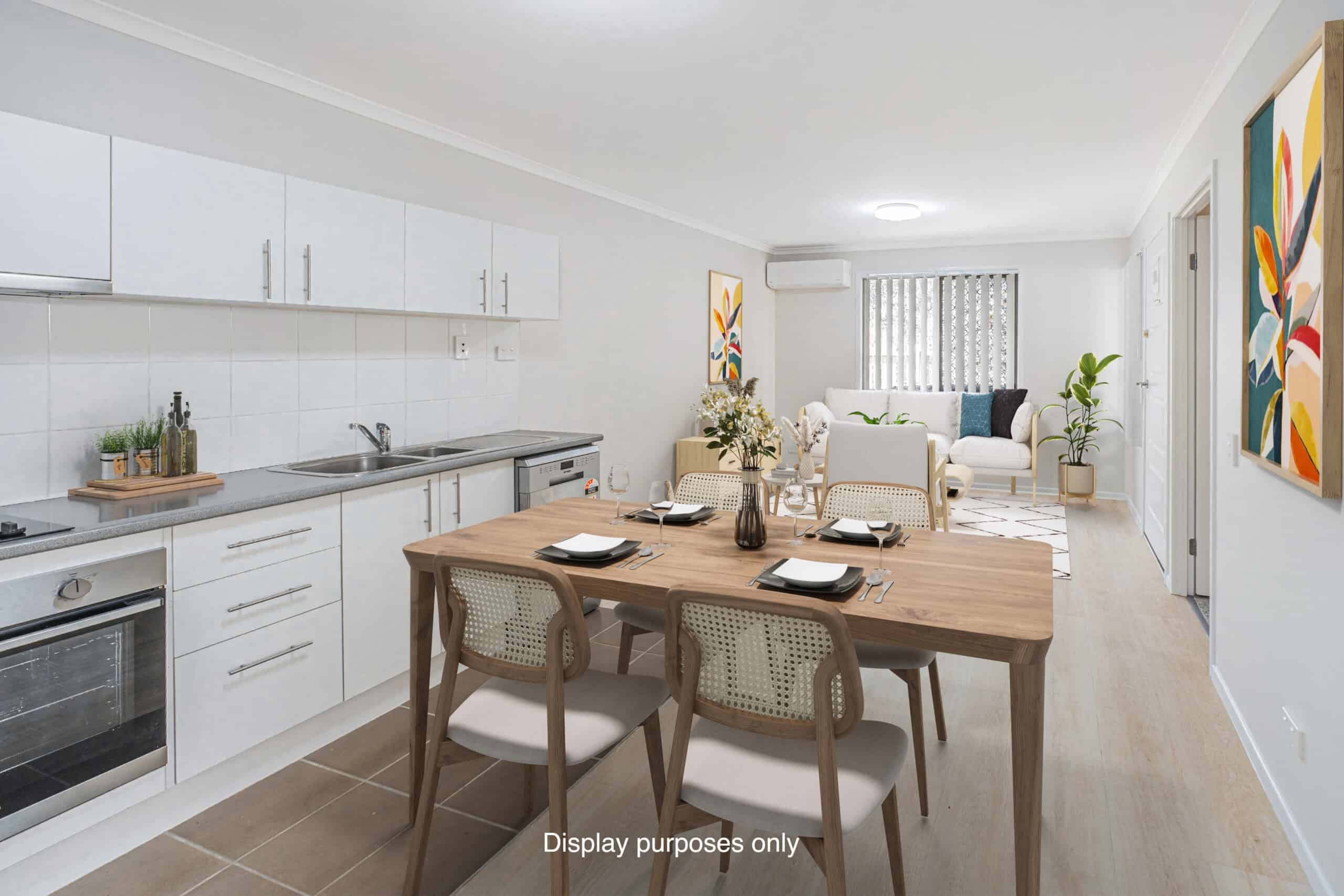 Open plan kitchen, dining, living area in on of our Oak Tree Goodna properties.