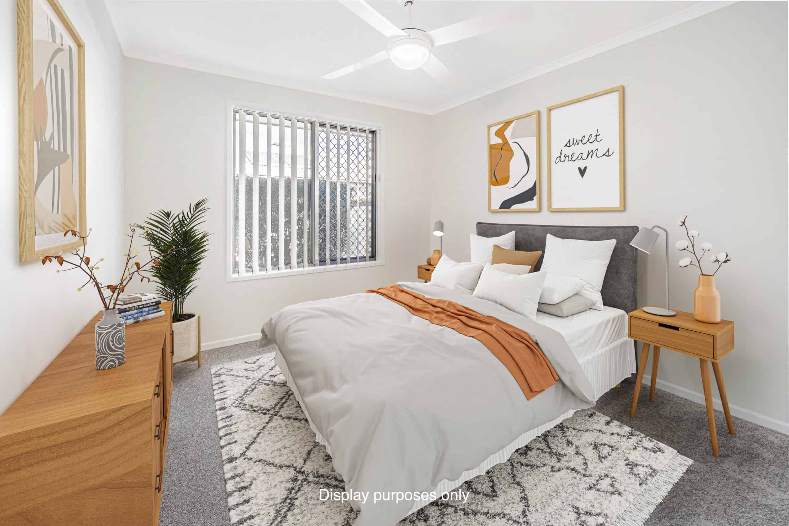 Bright, clean bedroom with bed, side table and bedside units in one of our Oak Tree Goodna retirement village properties.