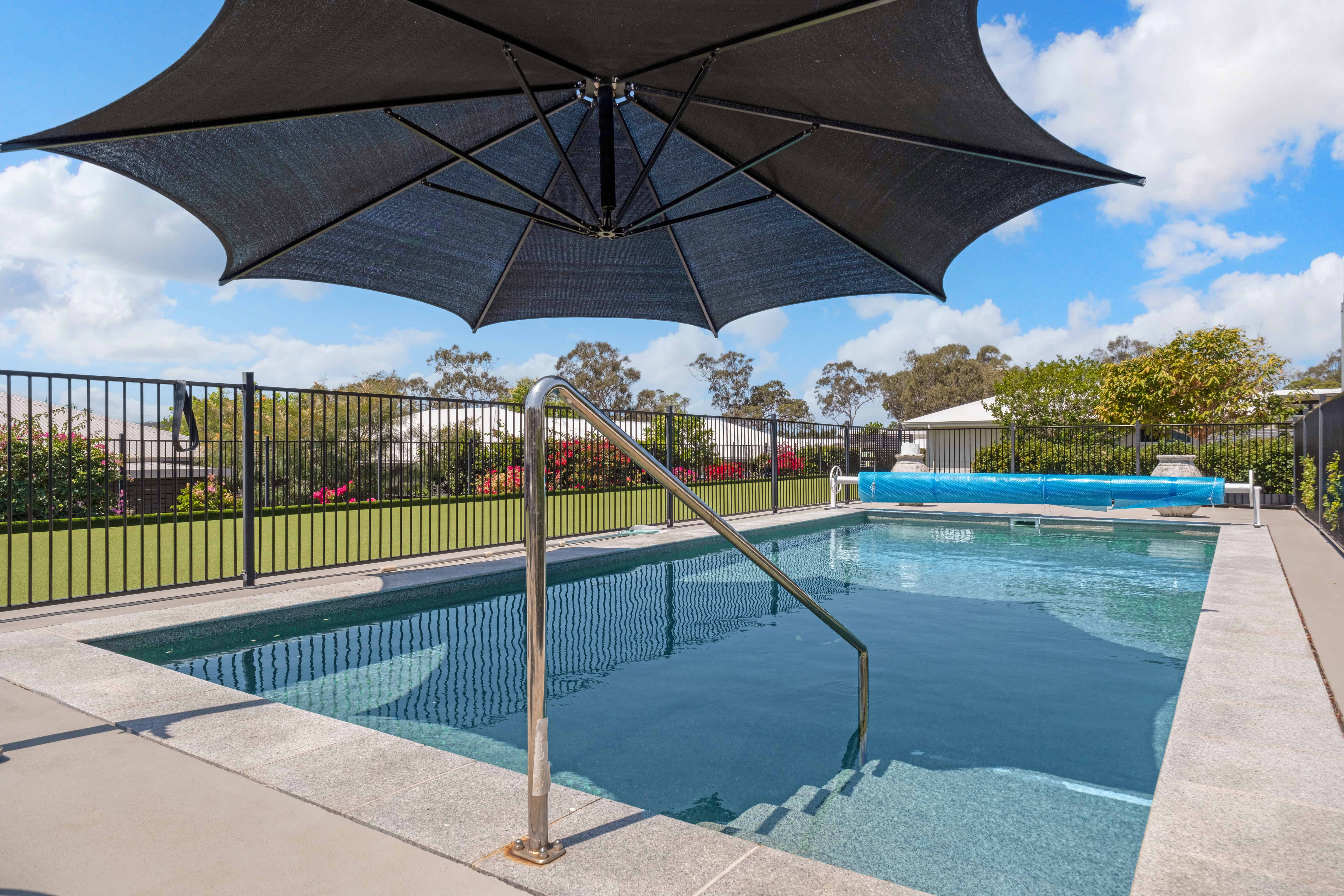 Relaxing outdoor swimming pool at Oak Tree Yeppoon Kookaburra Drive