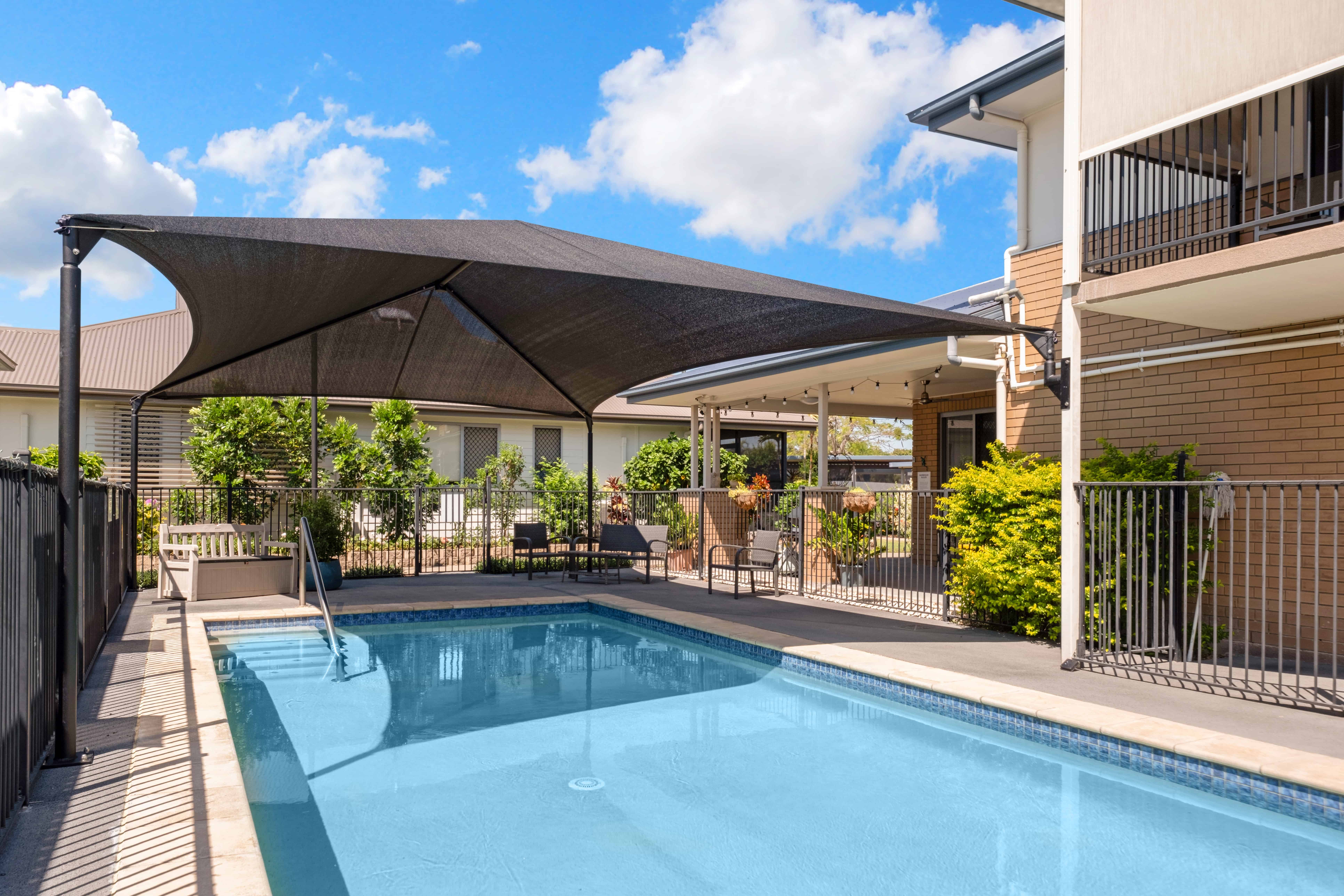 Pool and outdoor seating area at Oak Tree Park Avenue