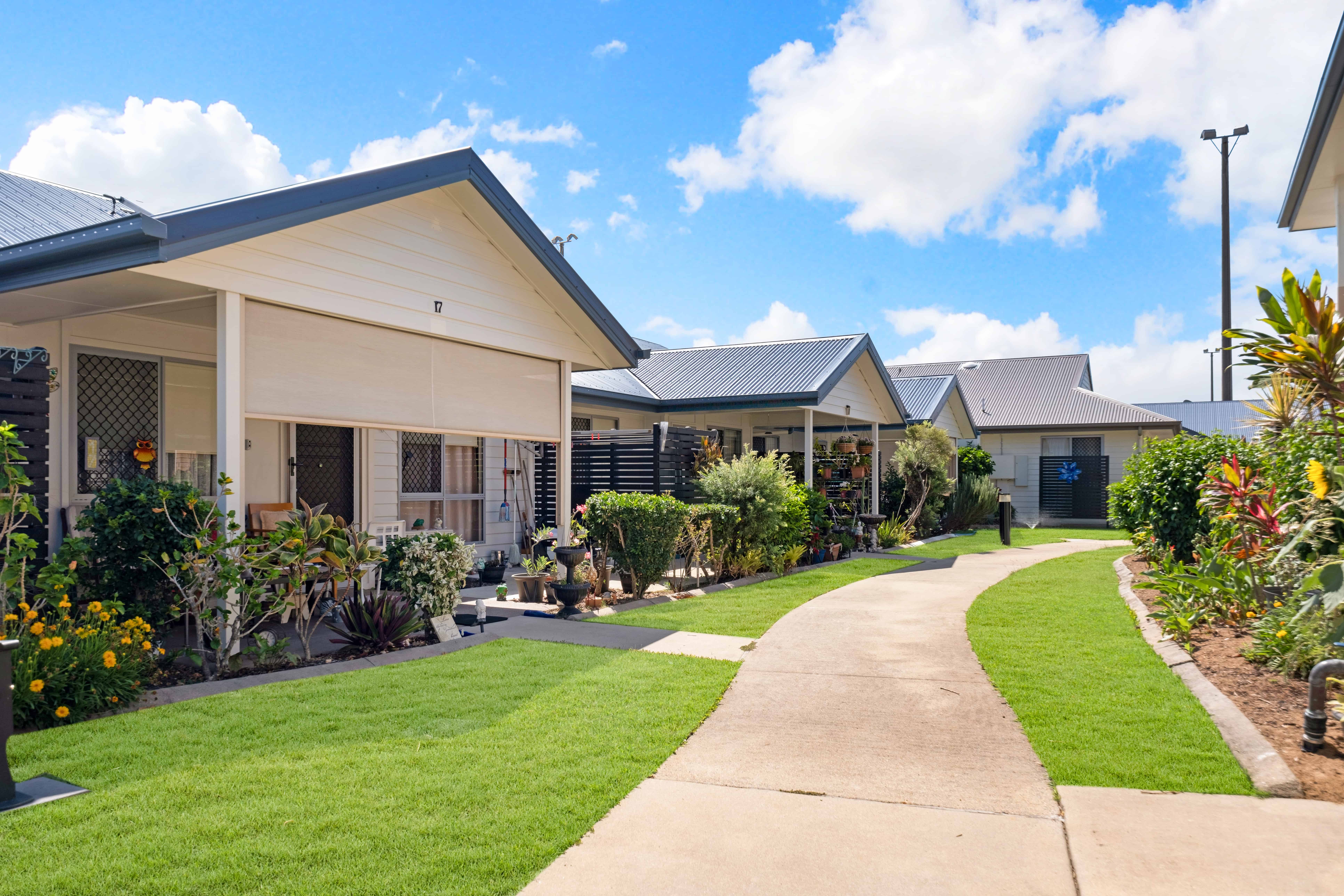 Well manicured outside space surrounding the village homes at Oak Tree Park Avenue