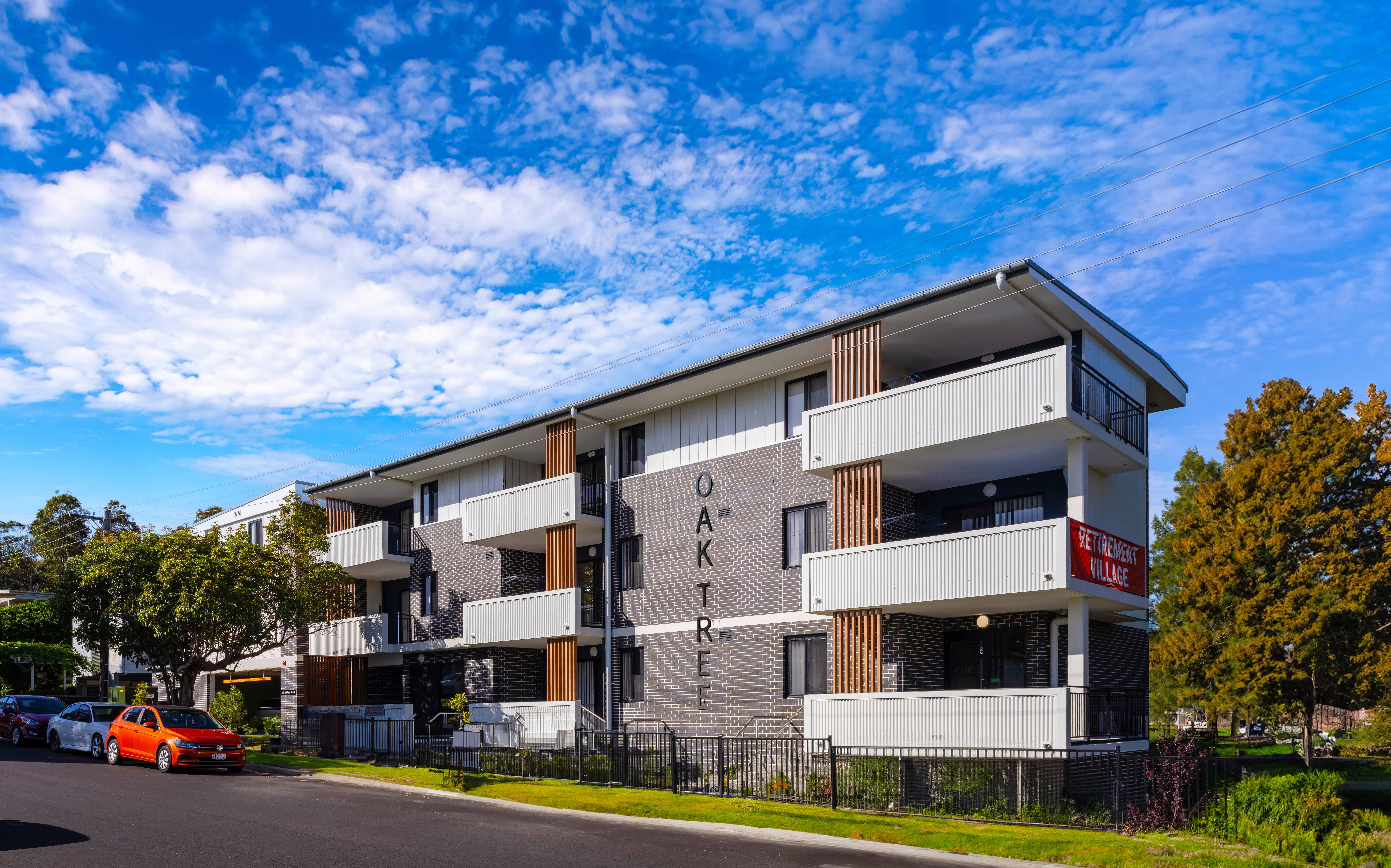 Exterior of Oak Tree Retirement Village Newcastle with Signage