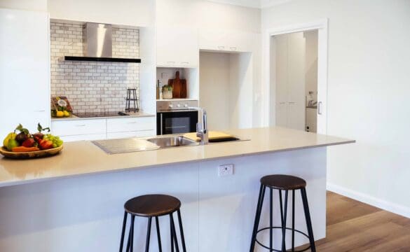 Modern kitchen area with bar stools in one of our Oak Tree Moss Vale Thorne Villas