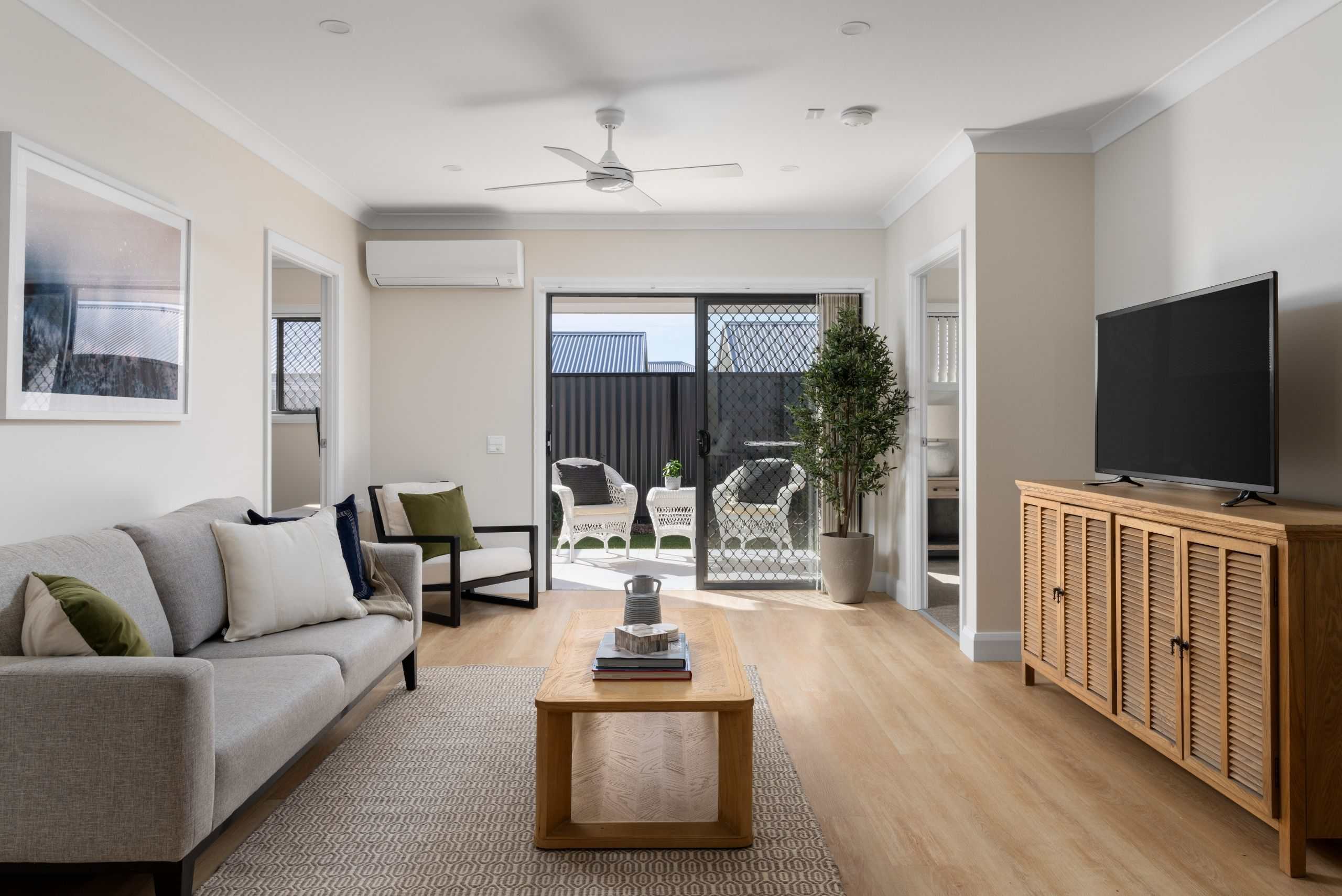 Retirement villa living room with courtyard access