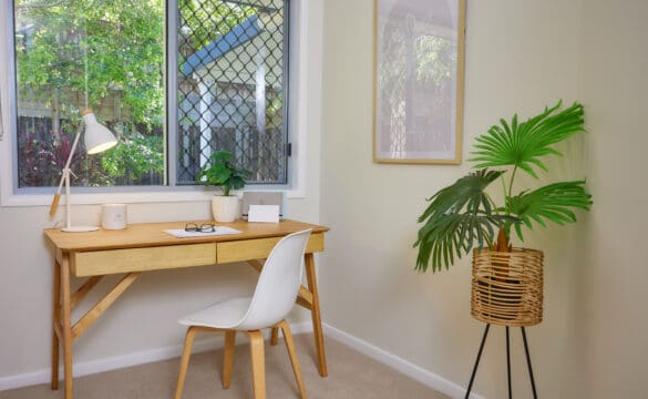 Office space with desk and plant in one of our Oak Tree Retirement Village Cairns Villas