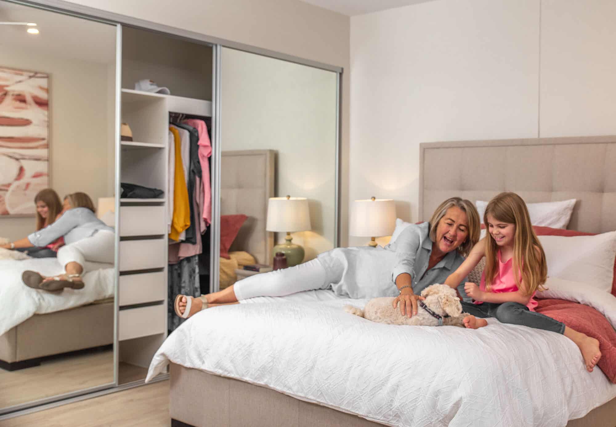 Family enjoying the bedroom at our Pelican Waters Retirement Village