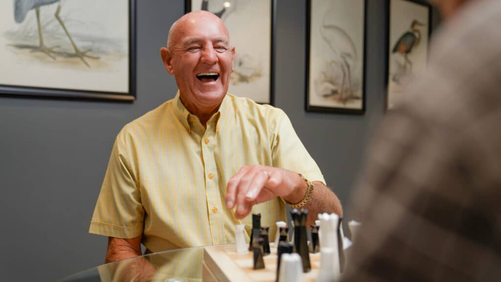 A senior resident playing chess enjoying life at one of our Newcastle Retirement Villages