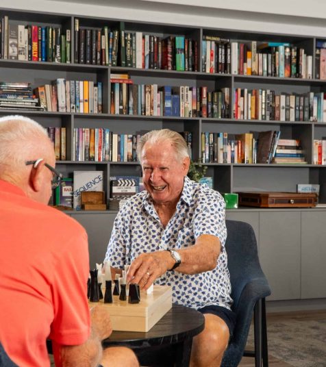 Men playing chess at Coffs Harbour retirement village
