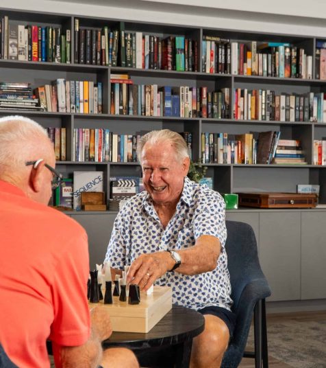 Men playing chess at Coffs Harbour retirement village