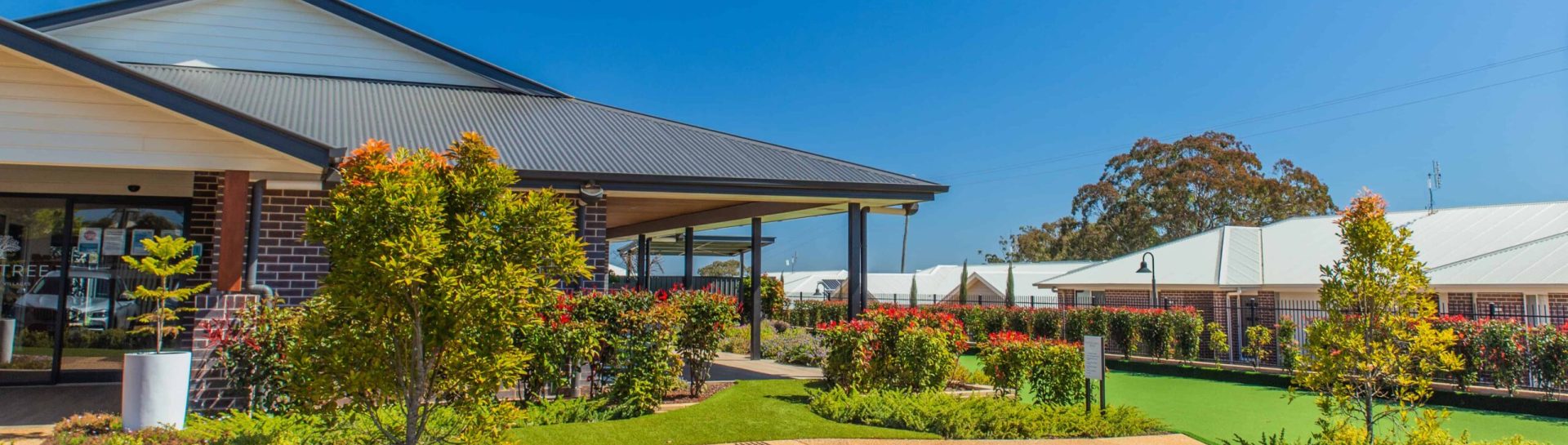 Exterior and well maintained gardens at Oak Tree Retirement Village Darling Heights, Platz Street