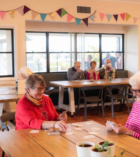 Seniors enjoying games in the communal area at Oak Tree Mudgee