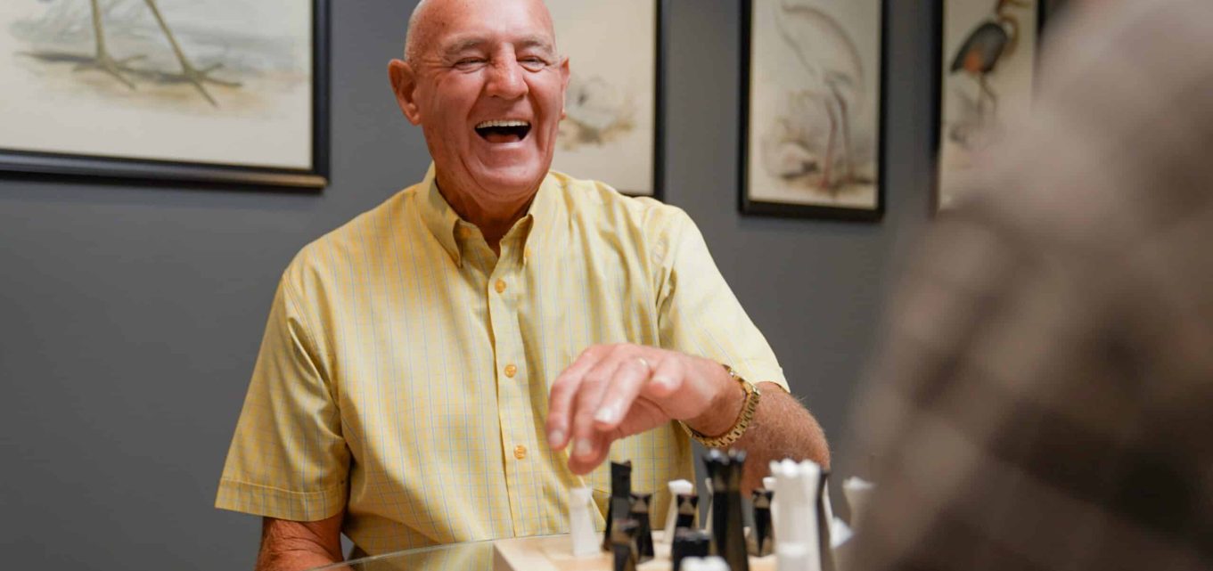 A senior resident playing chess enjoying life at one of our Newcastle Retirement Villages