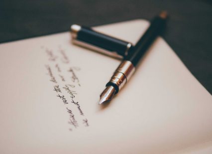 A fountain pen and paper