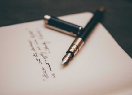 A fountain pen and paper