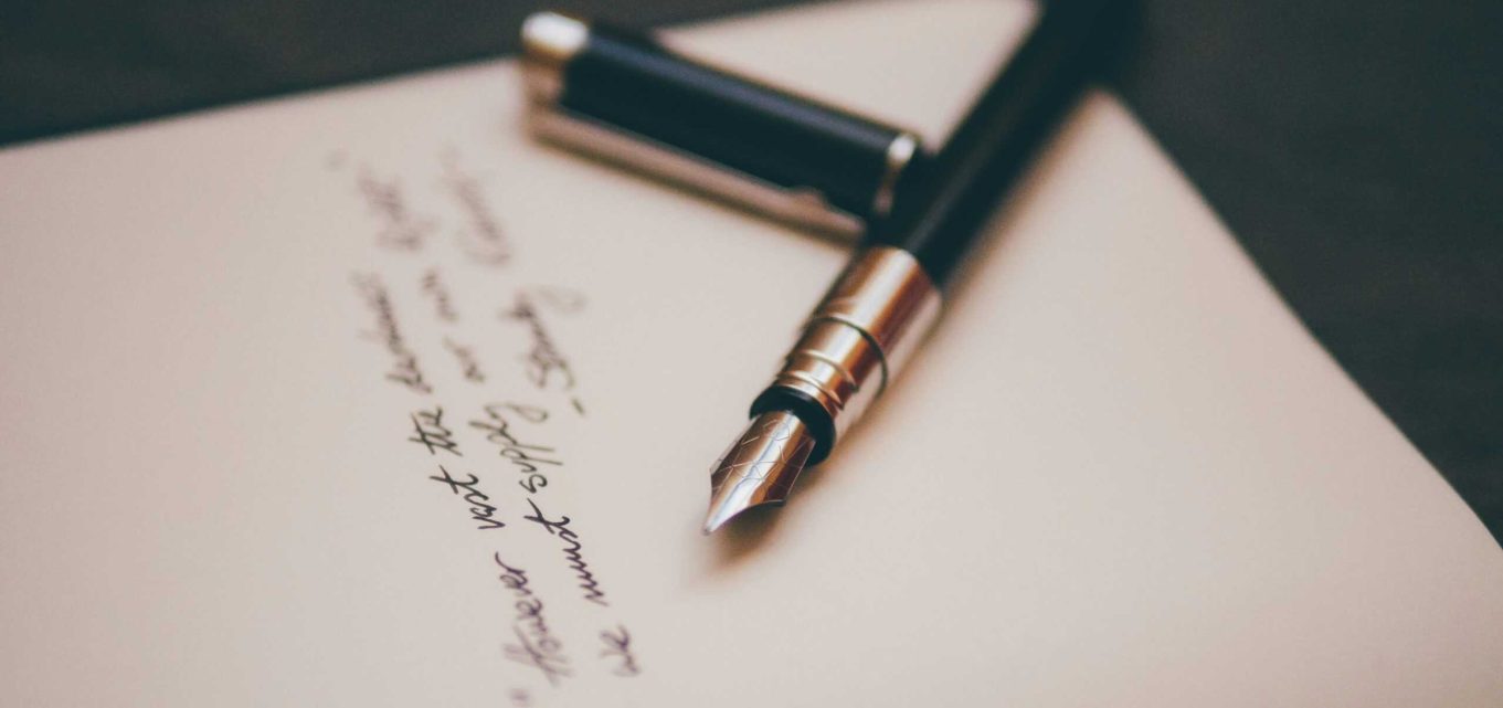 A fountain pen and paper