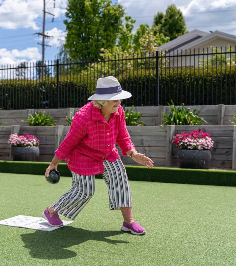 Senior woman enjoying outdoor games at Oak Tree Retirement Village